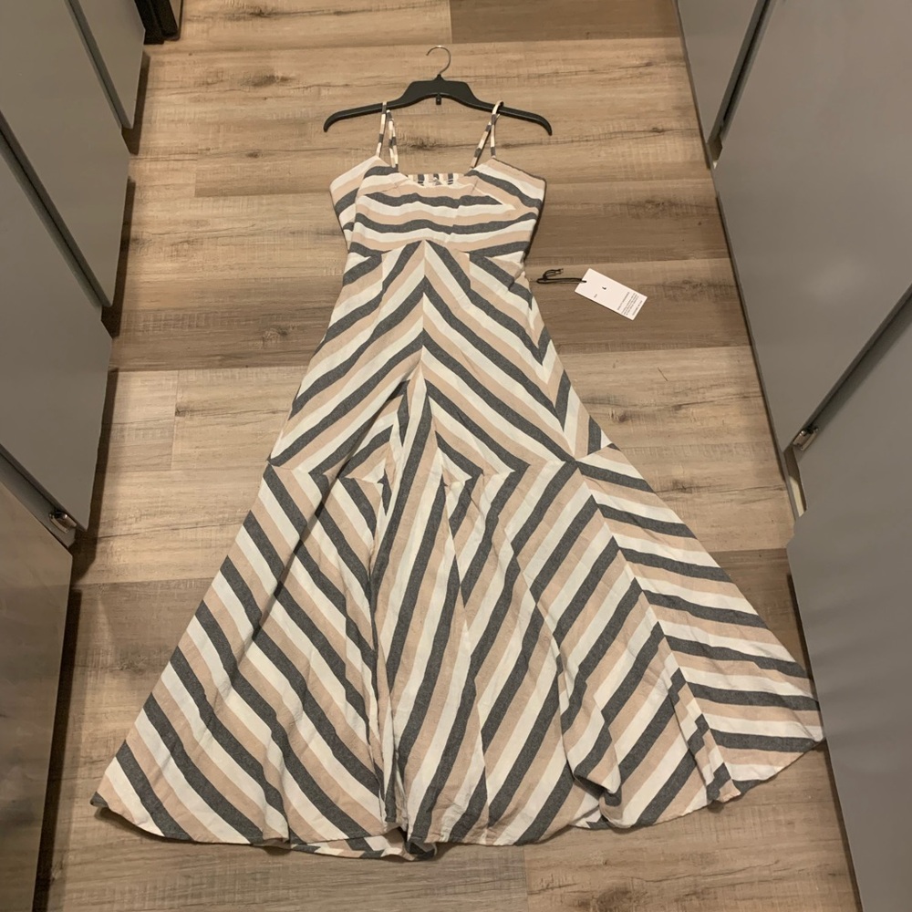 Stripped maxi dress with adjustable straps. Brand new with tags.